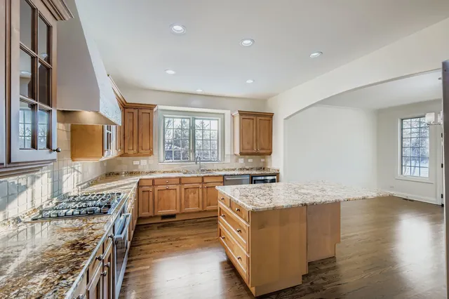 a kitchen with a stove a sink and a refrigerator