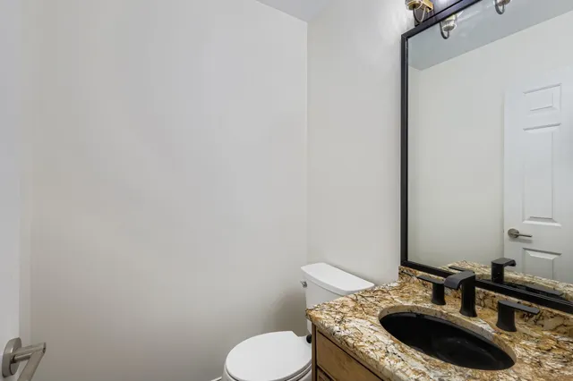 a view of entryway with wooden floor and stairs