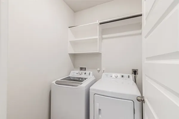 an aerial view of a house with a swimming pool