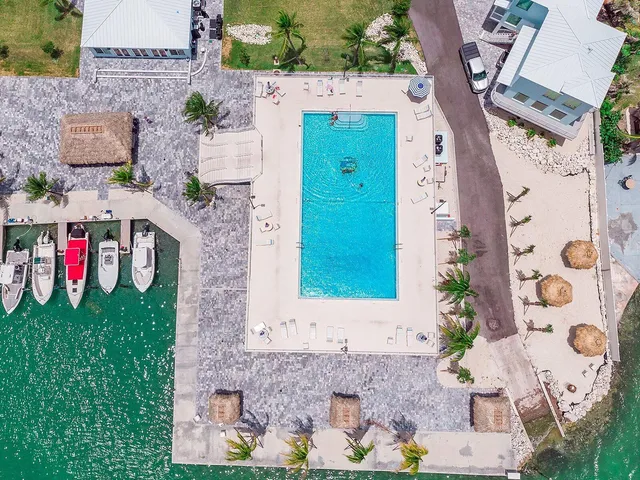 an aerial view of a house with outdoor space