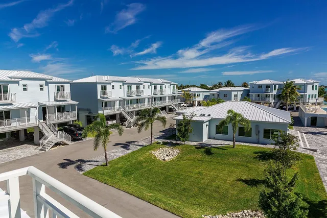 a view of a big yard with table and chairs