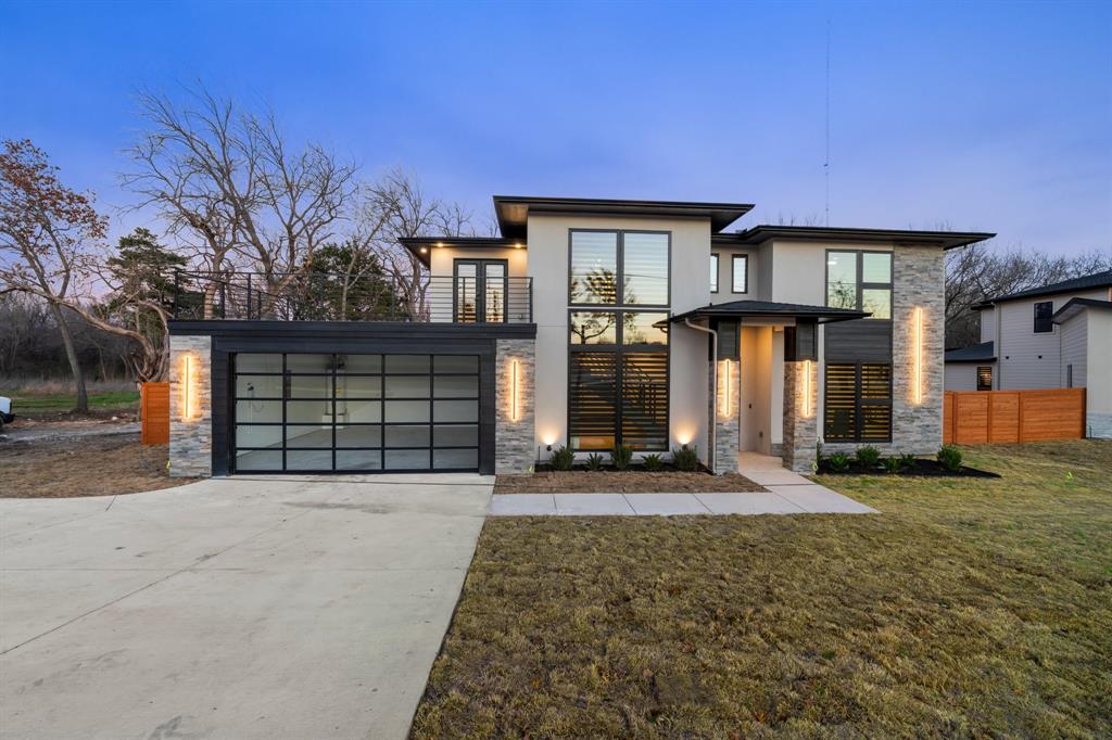 510 South Clark Road Cedar Hill, TX 75104 - Photo 1 of 1 a front view of a house with a yard and garage