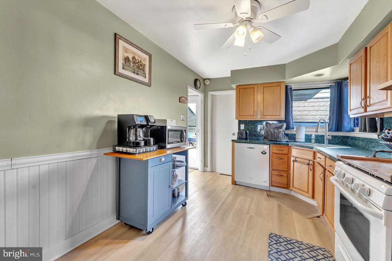 504 Jefferson Street Riverside, NJ 08075 - Photo 12 of 25 a kitchen with stainless steel appliances granite countertop a stove and a sink