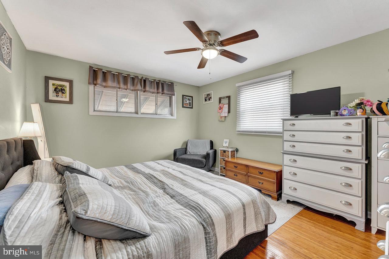 504 Jefferson Street Riverside, NJ 08075 - Photo 14 of 25 a bedroom with a bed and a flat screen tv