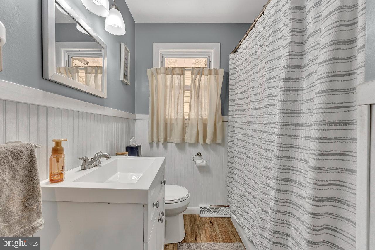 504 Jefferson Street Riverside, NJ 08075 - Photo 16 of 25 a bathroom with a sink a toilet and shower