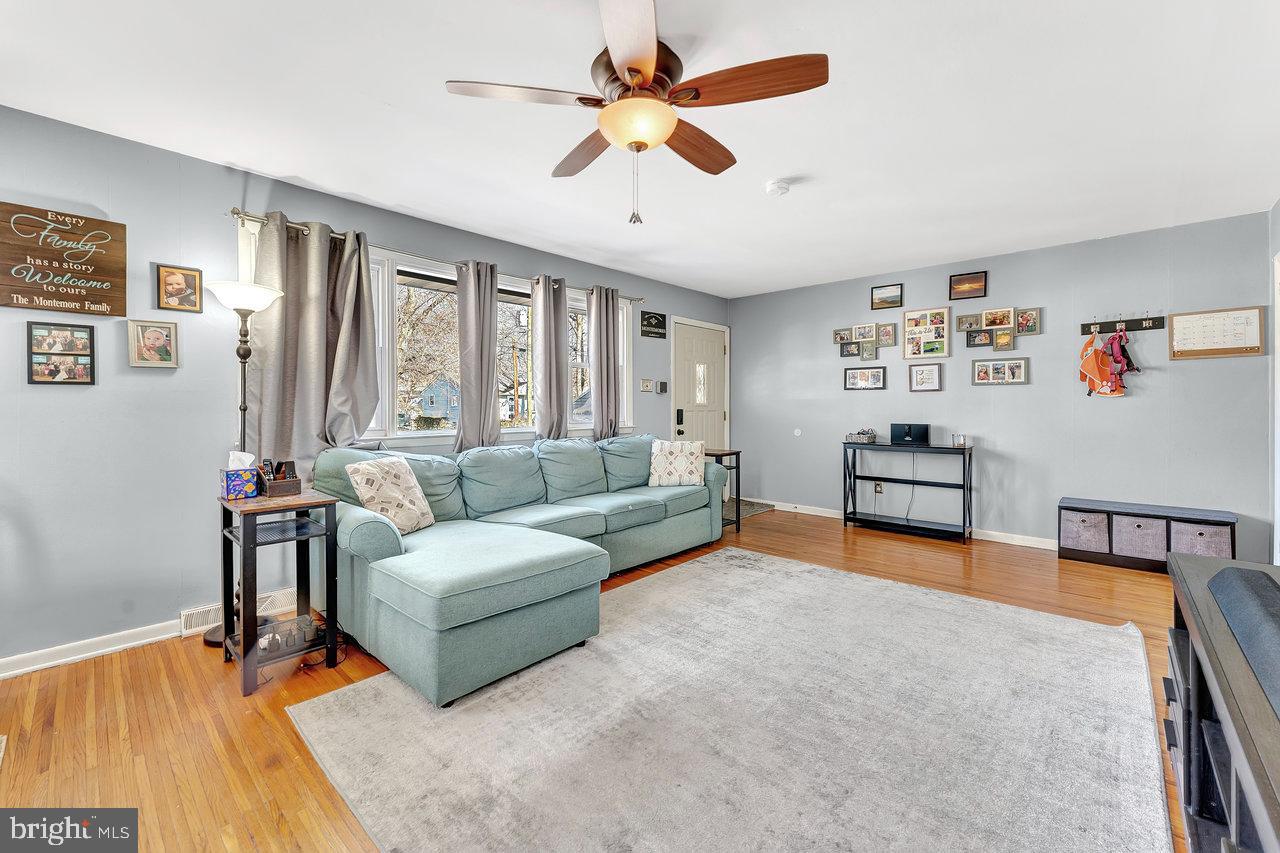 504 Jefferson Street Riverside, NJ 08075 - Photo 5 of 25 a living room with furniture and a large window