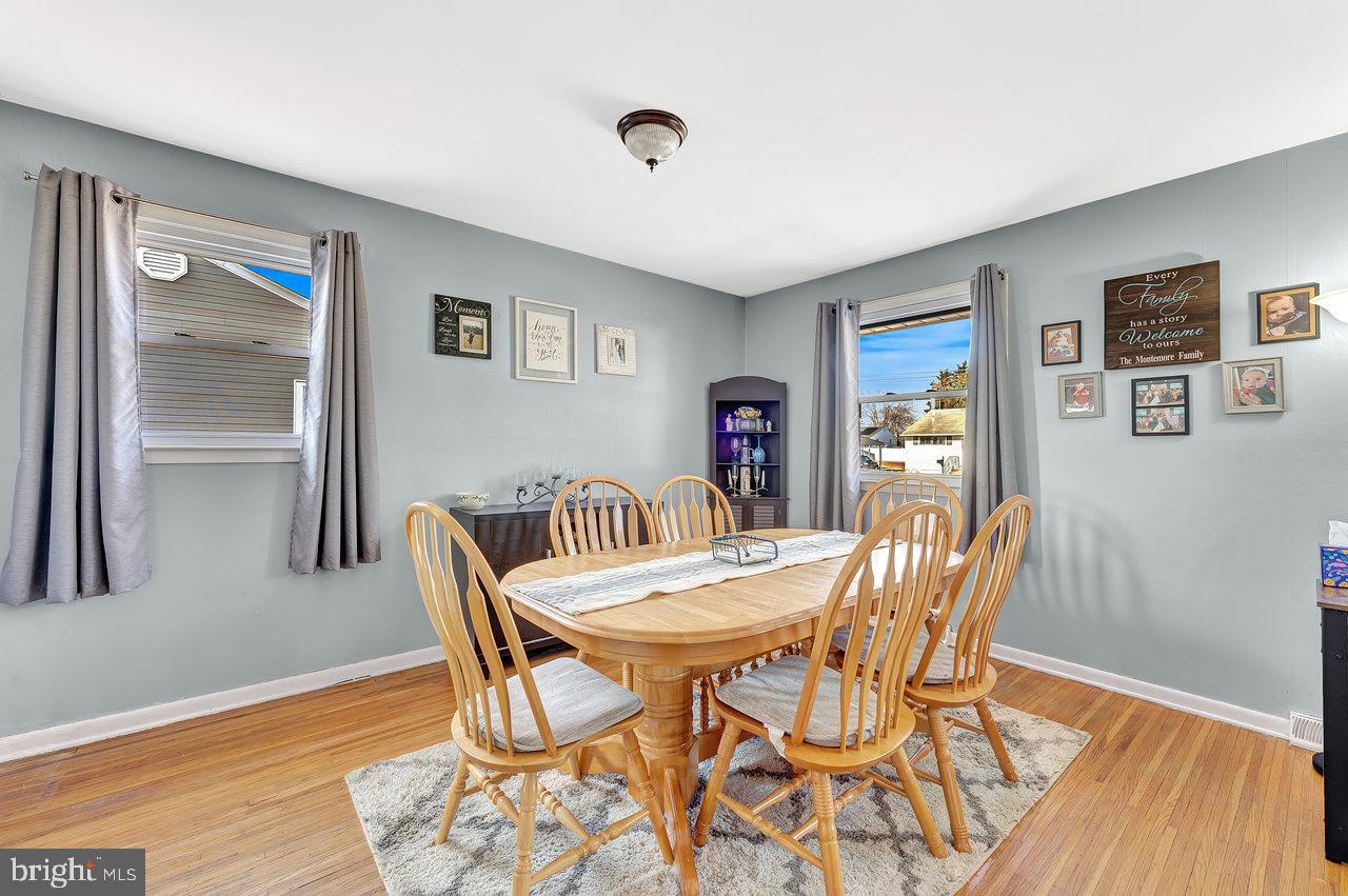 504 Jefferson Street Riverside, NJ 08075 - Photo 8 of 25 a view of a dining room with furniture and wooden floor