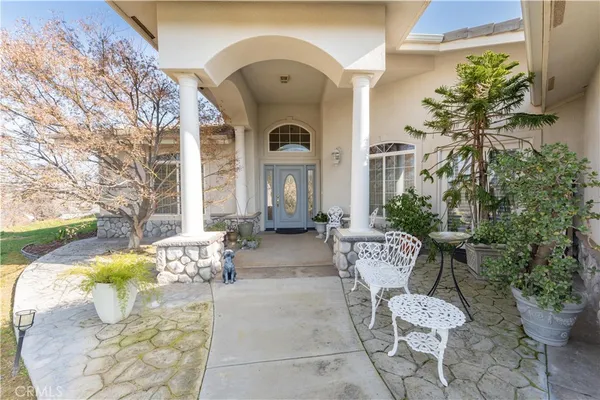 a view of a two chairs in the patio