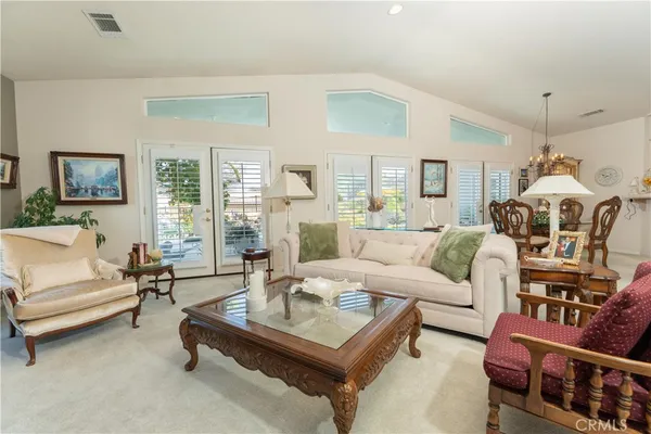 a living room with furniture and a table