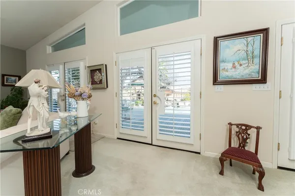 a view of a livingroom with furniture and a window