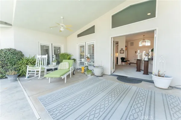 a view of living room filled with furniture and window