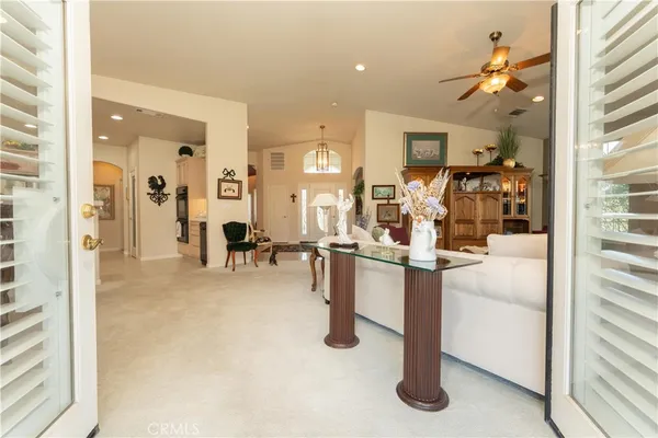 a view of kitchen with furniture and refrigerator