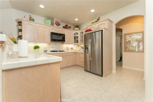 a kitchen with a sink cabinets and refrigerator