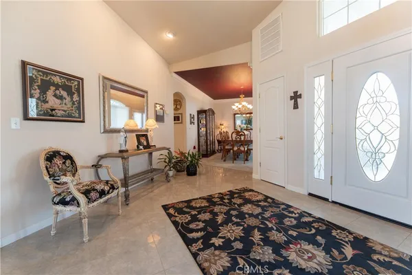 a very nice looking living room with a chair and a window