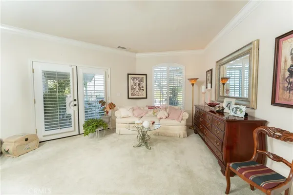 a living room with furniture and windows