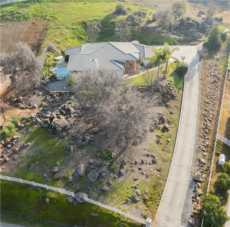 a view of a swimming pool with a yard
