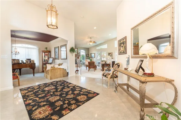 a living room with lots of furniture and a chandelier