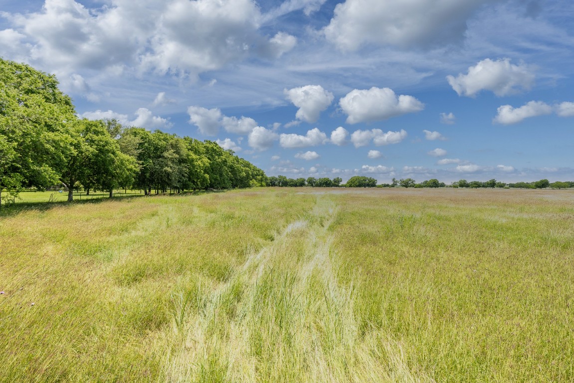 2091 Goodwin Road Gonzales, TX 78629 - Photo 11 of 23 a view of a lake and a yard