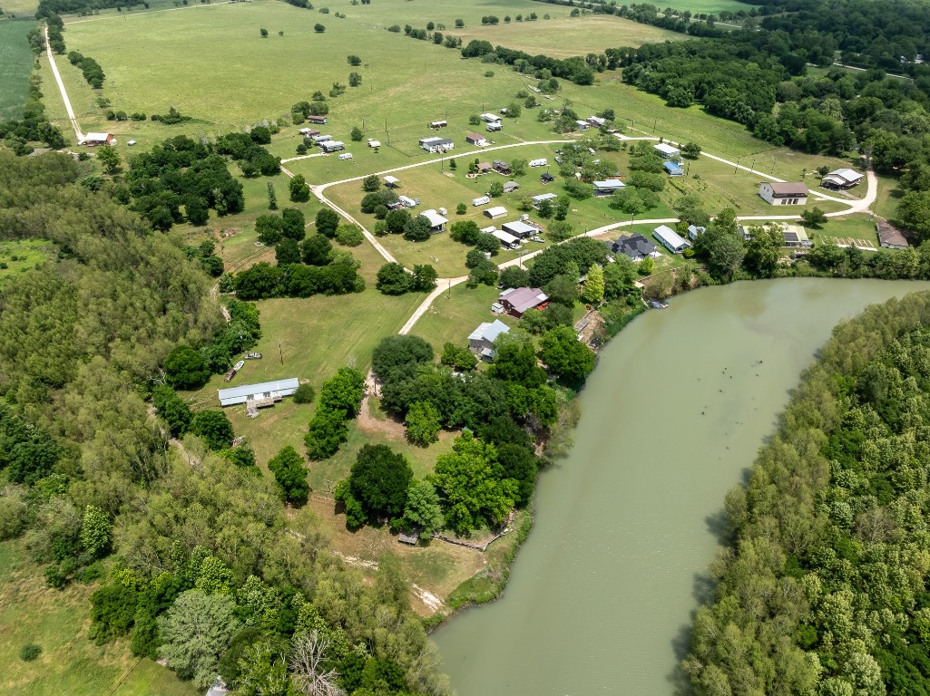 2091 Goodwin Road Gonzales, TX 78629 - Photo 17 of 23 an aerial view of residential houses with outdoor space and trees all around