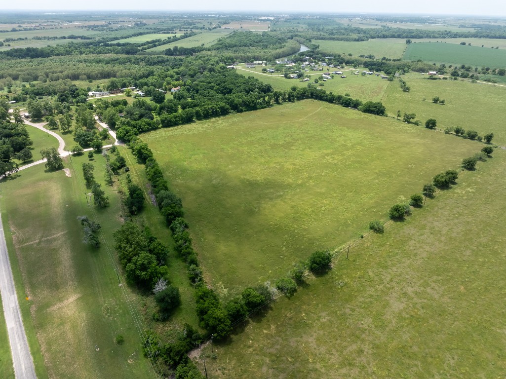 2091 Goodwin Road Gonzales, TX 78629 - Photo 21 of 23 an aerial view of a residential houses with outdoor space and trees