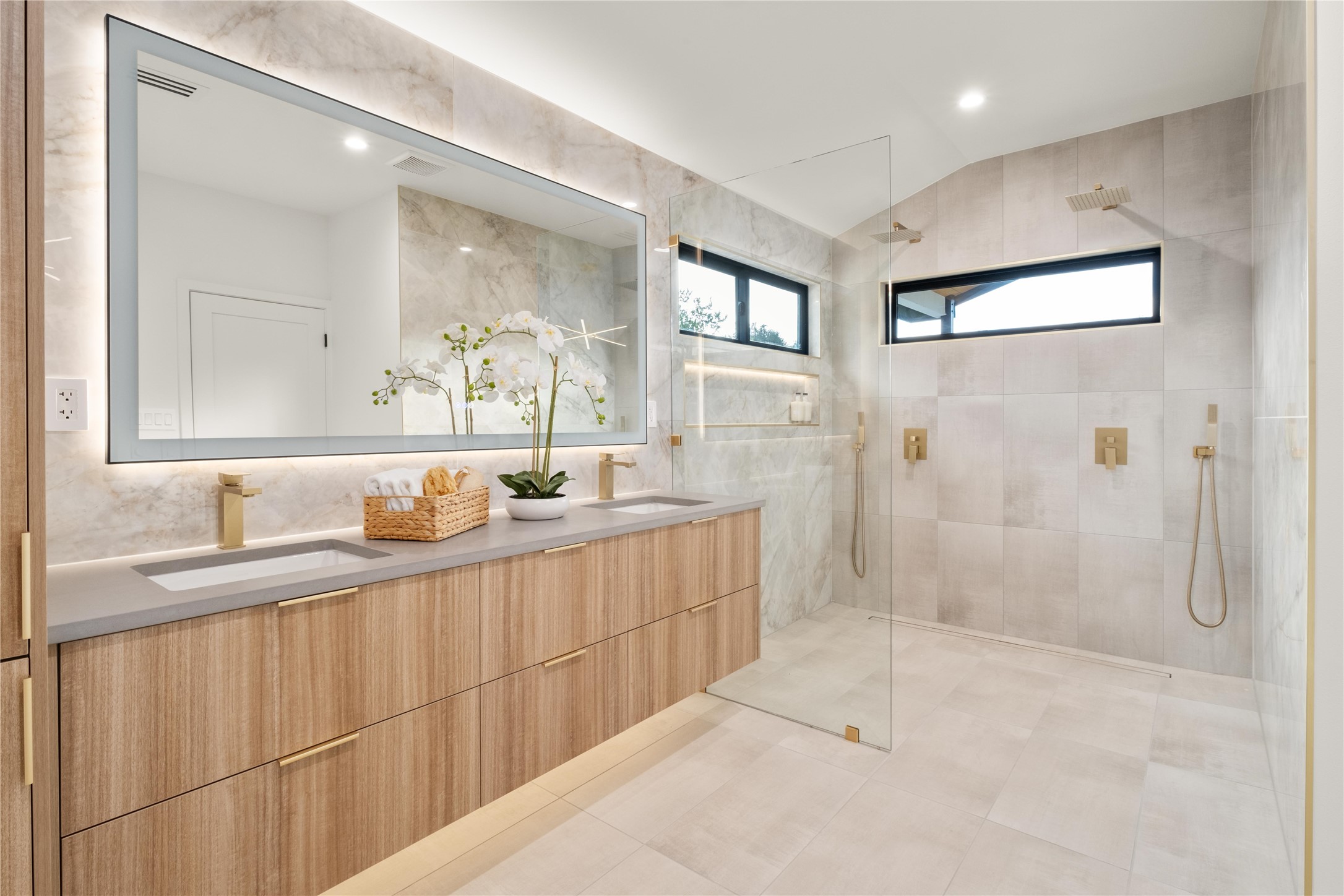 620 Bermuda Street Lakeway, TX 78734 - Photo 17 of 36 Bathroom featuring tiled shower, double vanity, lofted ceiling, and recessed lighting