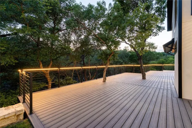 a bedroom with a bed and a night stand