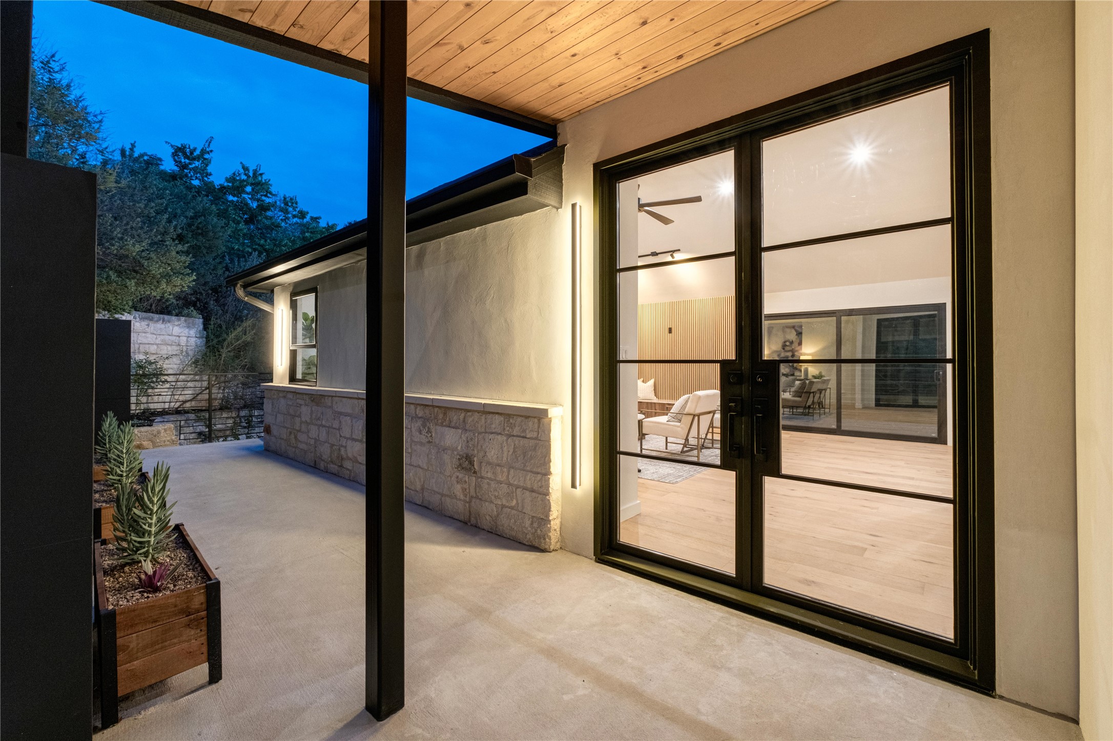620 Bermuda Street Lakeway, TX 78734 - Photo 6 of 40 a view of a porch with a floor to ceiling window and a table
