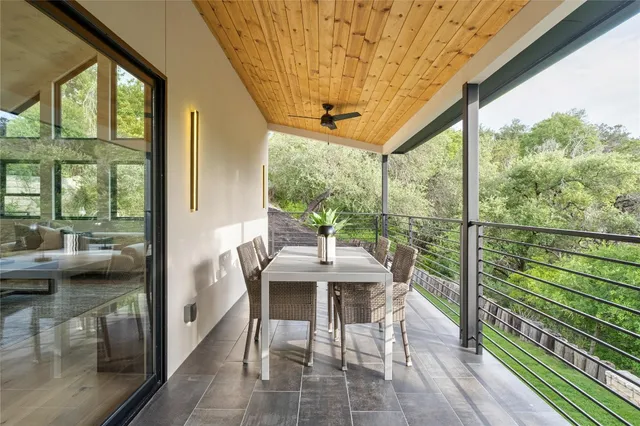 a view of a patio with a table chairs and a table