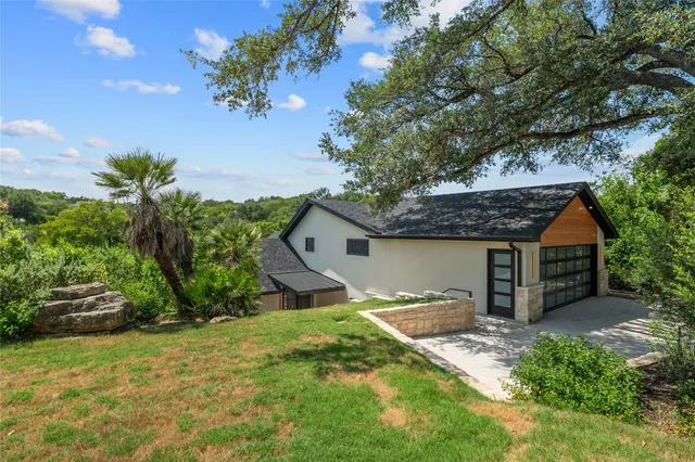 a view of a dining room with furniture a rug and wooden floor