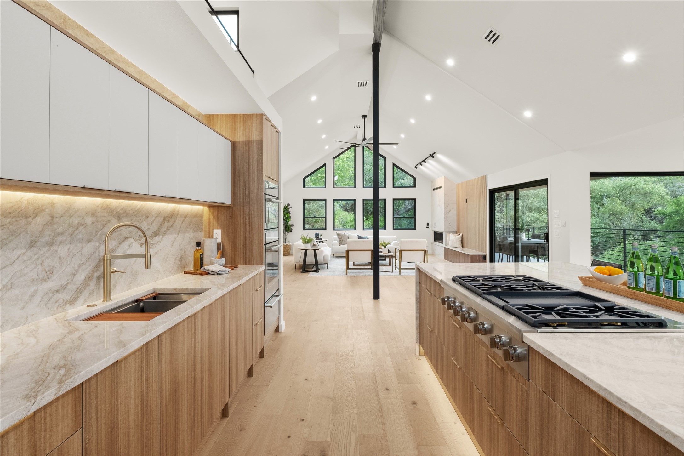 620 Bermuda Street Lakeway, TX 78734 - Photo 8 of 36 Kitchen with modern cabinets, a sink, stainless steel gas cooktop, healthy amount of natural light, and beamed ceiling