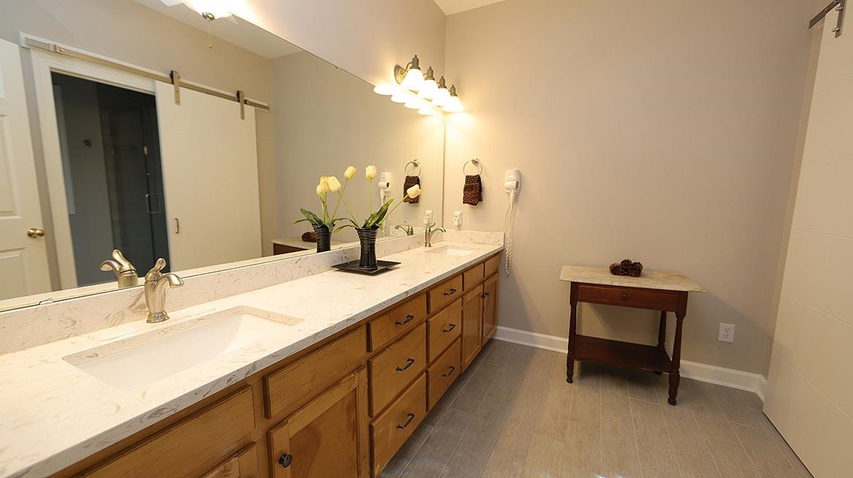 6133 View Water Drive Raleigh, NC 27606 - Photo 19 of 43 Double vanity and tile flooring