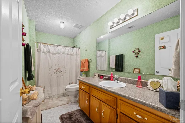 a bedroom with a bed and a book shelf