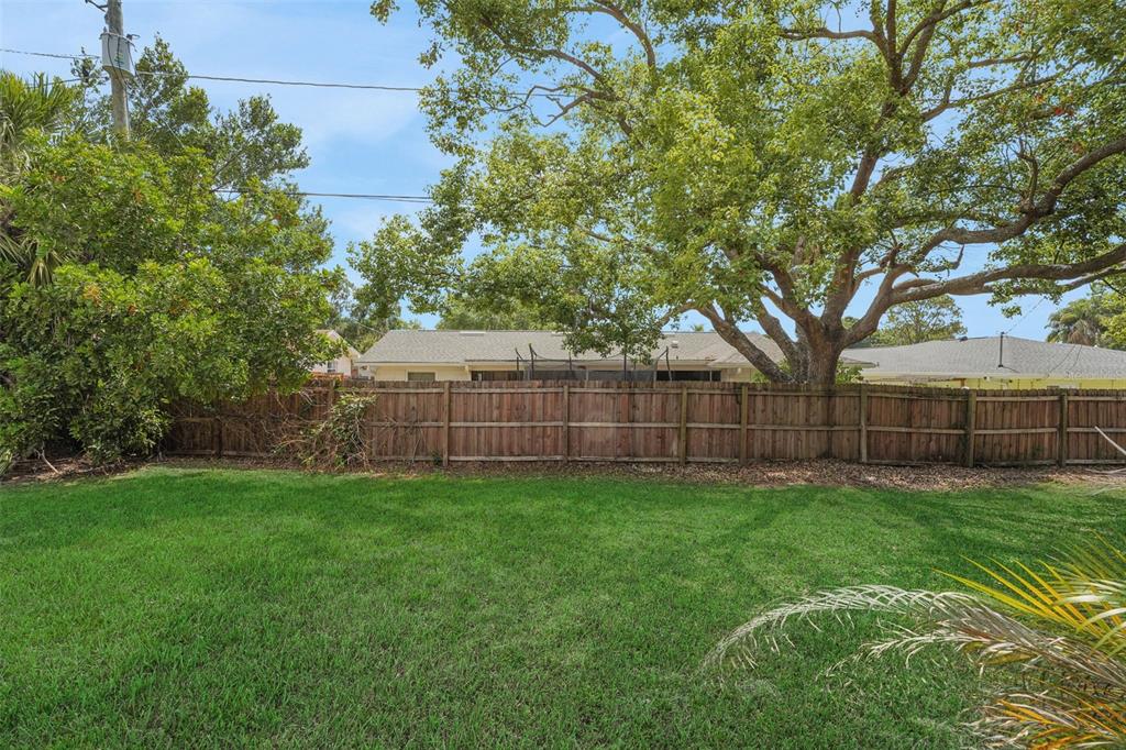 404 Lake Ned Road Winter Haven, FL 33884 - Photo 18 of 18 a view of a backyard with a small cabin