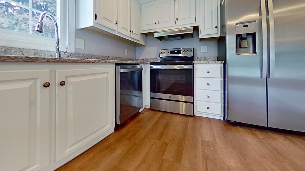 4 Juniper Circle Rockland, MA 02370 - Photo 1 of 11 a kitchen with stainless steel appliances granite countertop a refrigerator and a stove