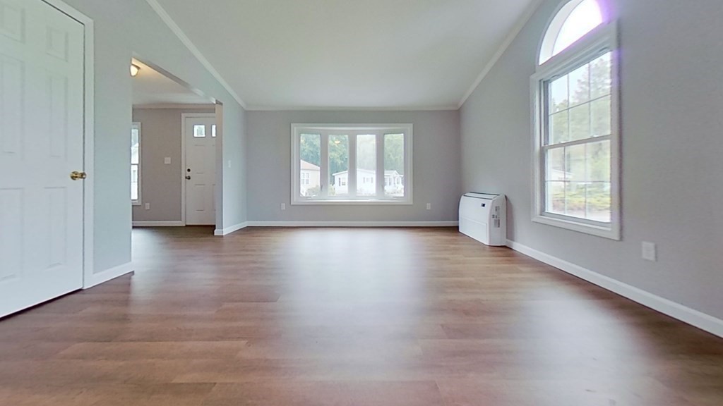 4 Juniper Circle Rockland, MA 02370 - Photo 8 of 11 an empty room with wooden floor and windows
