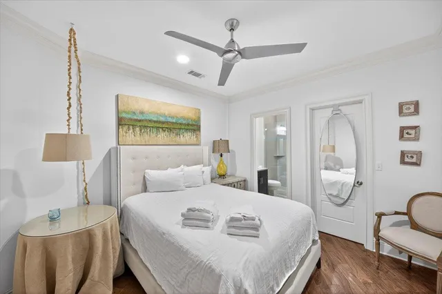 a bedroom with a bed a couch and dresser