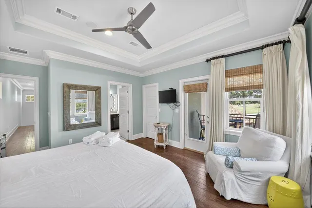 a bedroom with a bed couch and window