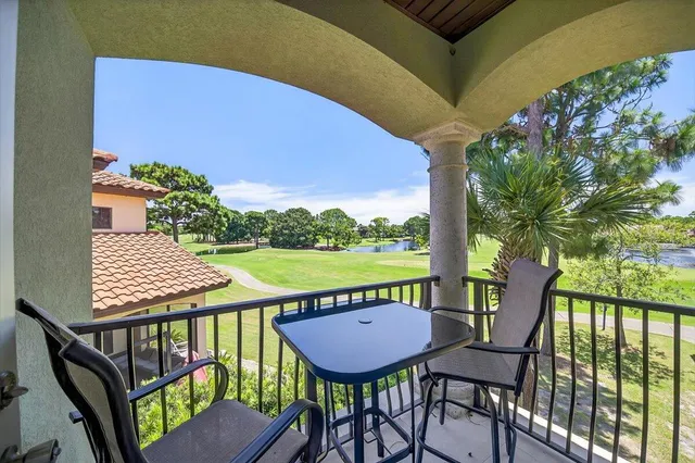 a view of a balcony with furniture