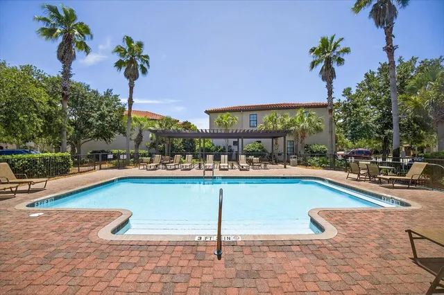 a view of a swimming pool with a lounge chair