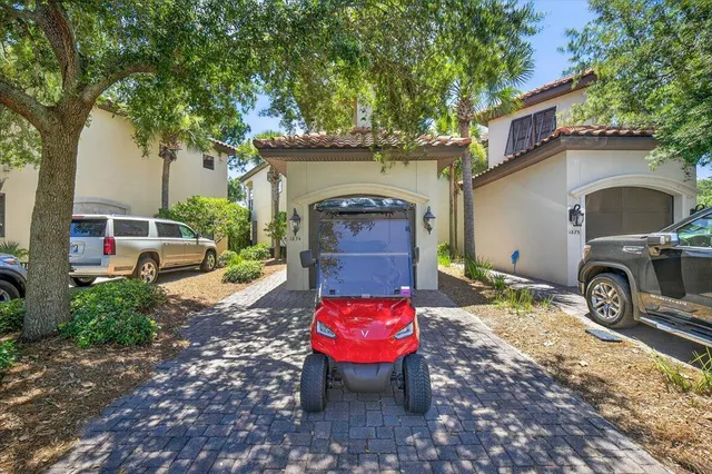 a view of a chair and table in backyard of the house