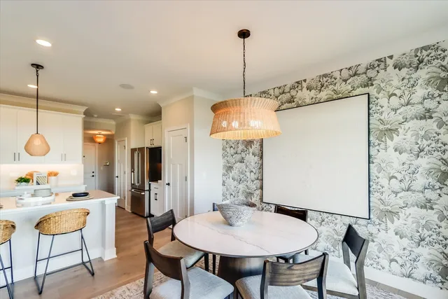 a very nice looking dining room with a table and chairs