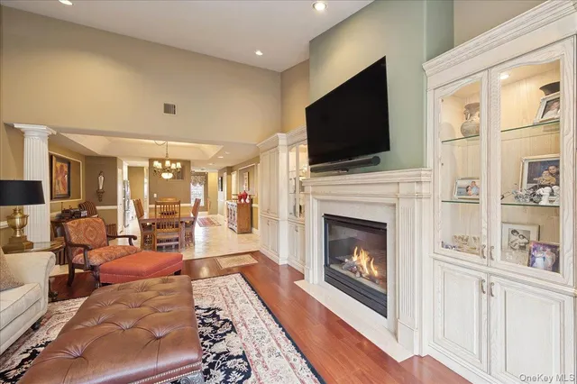 a living room with furniture fireplace and flat screen tv