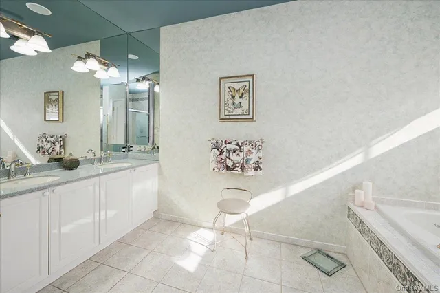 a bathroom with a double vanity sink and a mirror