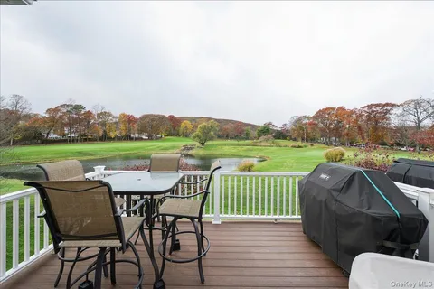 an outdoor sitting area with furniture and garden