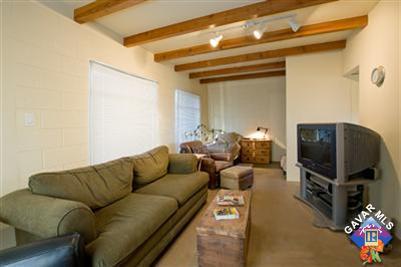 7671 Quartz Road Mojave, CA 93501 - Photo 4 of 10 a living room with furniture and a flat screen tv