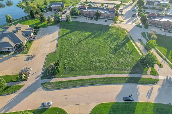 an aerial view of a residential houses with outdoor space