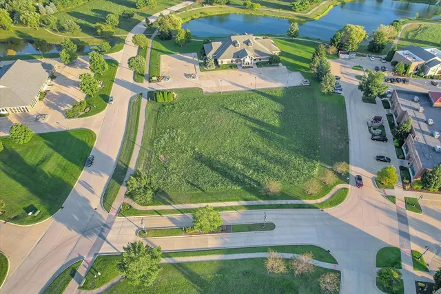 an aerial view of a residential houses with outdoor space