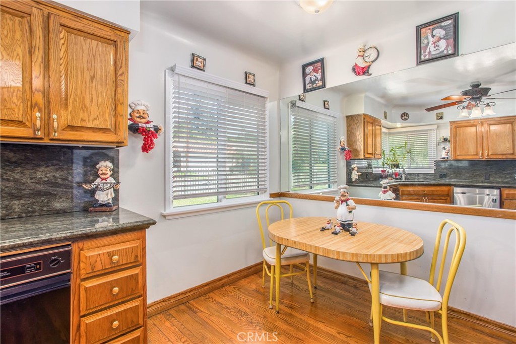 3095 Pepper Tree Lane San Bernardino, CA 92404 - Photo 11 of 29 a kitchen with stainless steel appliances granite countertop a sink and a refrigerator