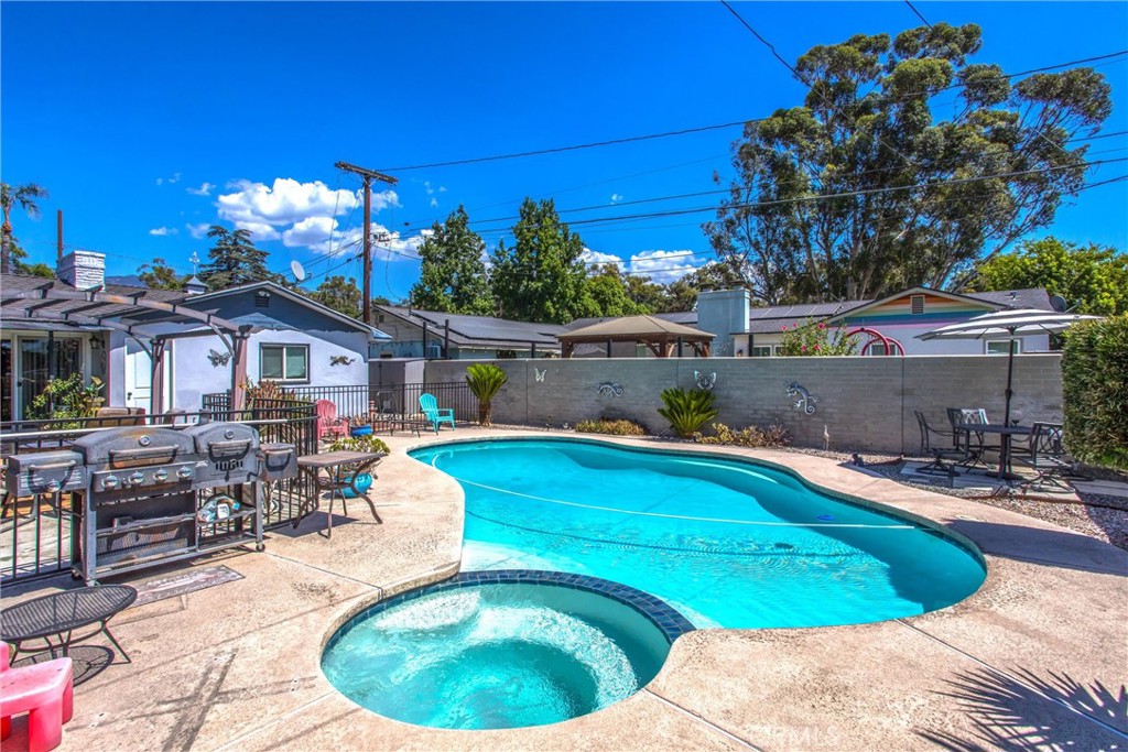 3095 Pepper Tree Lane San Bernardino, CA 92404 - Photo 23 of 29 a swimming pool with outdoor seating yard and outdoor seating