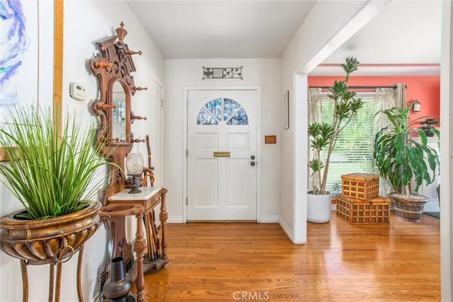 a view of an entryway with a flower in a room